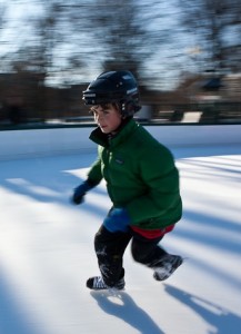 Young boy ice skating at Boston Common Frog Pond